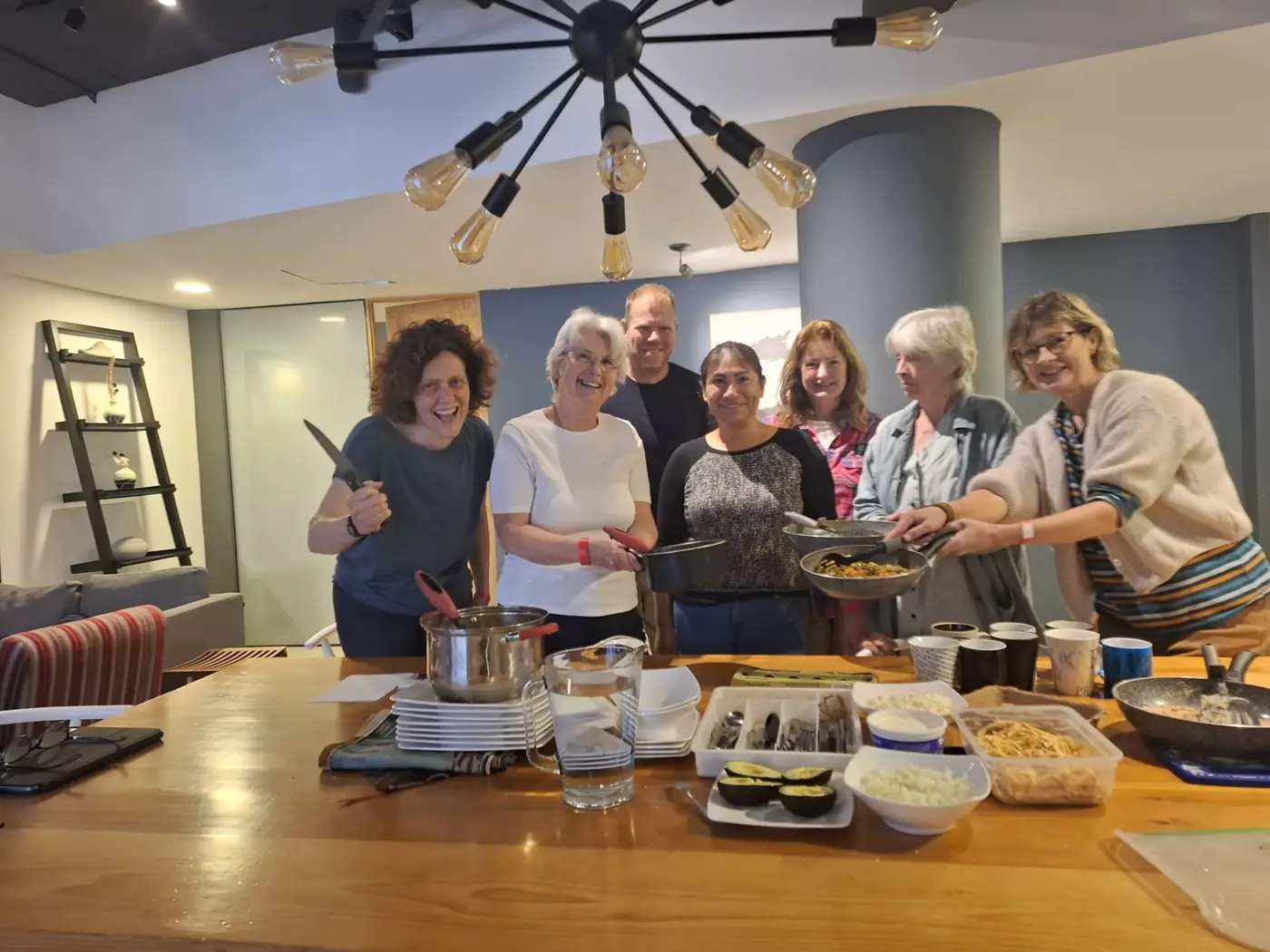 A small group enjoying a hands-on Mexican cooking experience