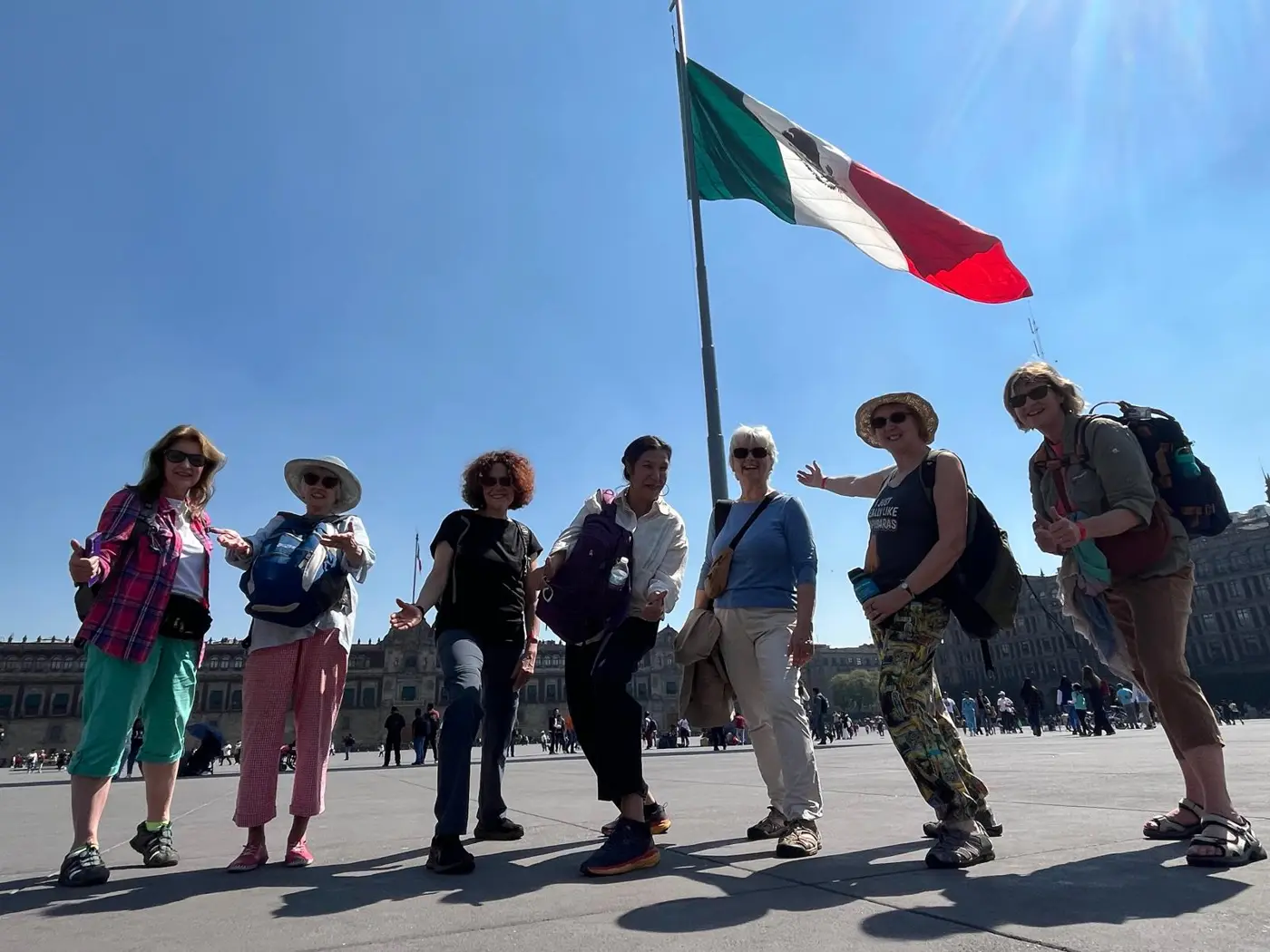 A Hay Spanish group beneath the Mexican flag in Mexico City